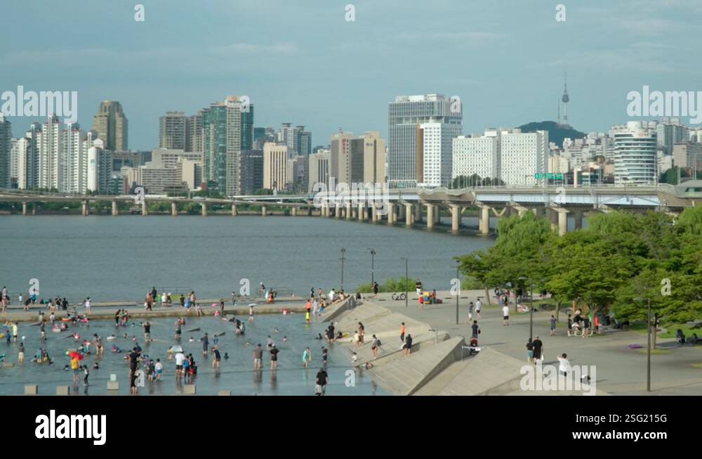 Zoom out from Seoul city skyline with Mapo bridge to Yeouido Hangang ...