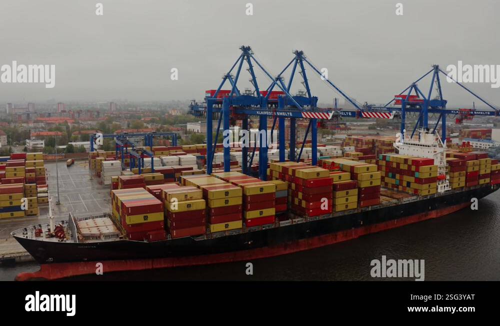 Industrial port with containers. Delivery of goods to the port by barge ...