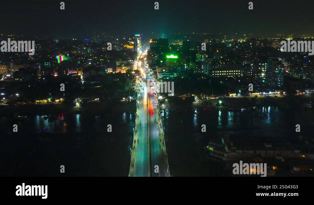 Amazing aerial city night hyperlapse of highway bridge over a river ...