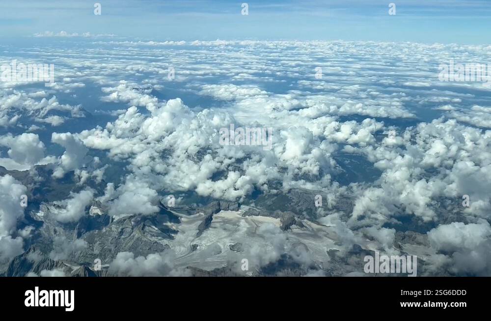 Aerial view taken from a jet cockpit of a alpine glacier in a summer ...