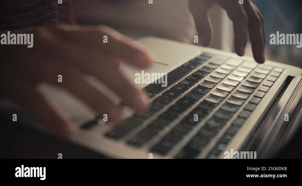Woman typing on a laptop keyboard while working. Cinematic close up ...