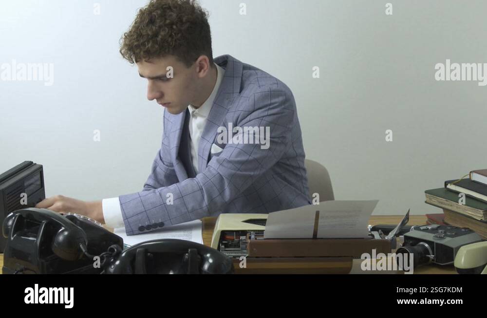 Young reporter on work, Retro 70s. Writer typing on typewriter, hear ...