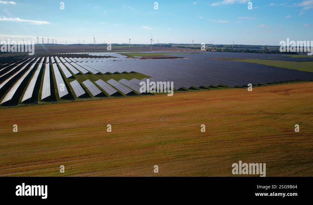 Solar panel rows in green energy production facility, aerial pedestal ...