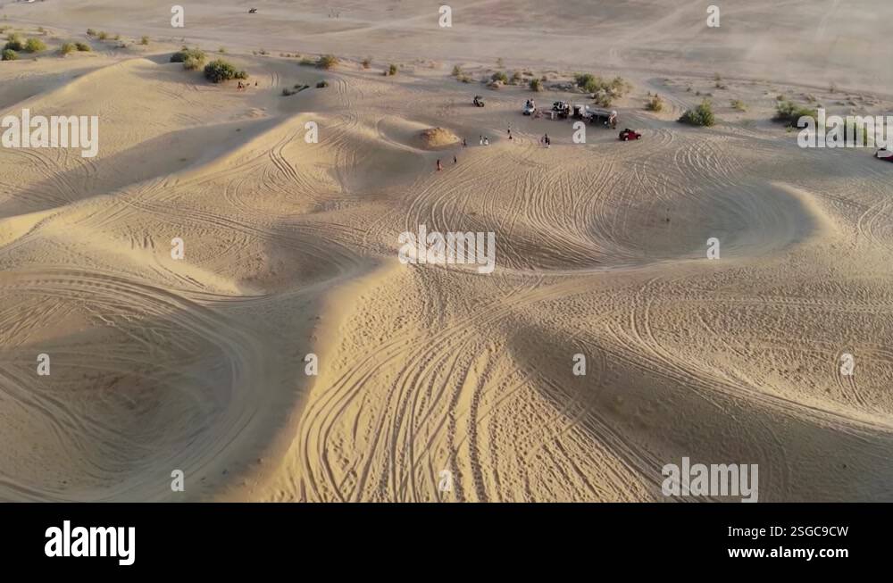 Drone tracking of a car driving in the Sahara desert of Rajasthan Stock ...