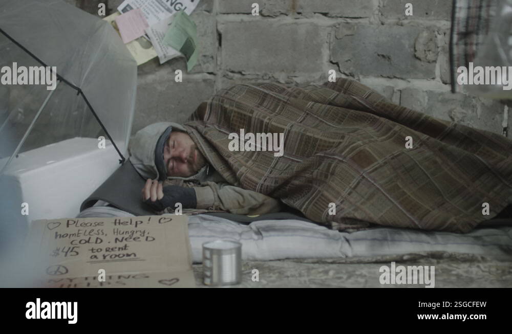 Homeless Beggar Sleeping in Rags on City Street Stock Video Footage - Alamy