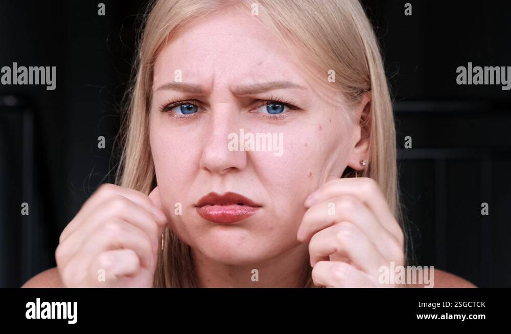 Pull Skin Back Second chin, obesity. Portrait of a 30-year-old woman pulling back the ...
