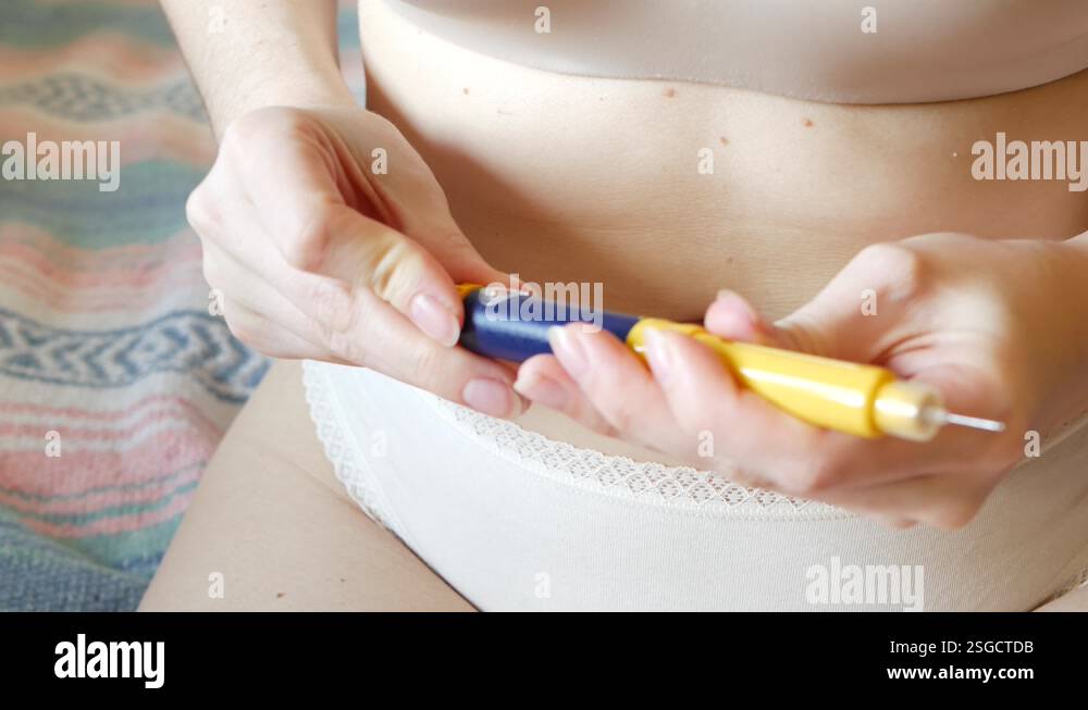 Females stomach, belly or abdomen. Woman injecting insulin, injection ...