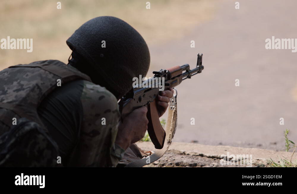 Crying Loading Gun Armed man unloading machine gun with machine gun in his hands, soldier ...