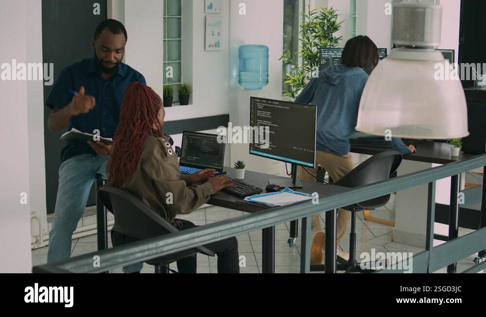 Junior developer working on terminal window to code system script Stock ...