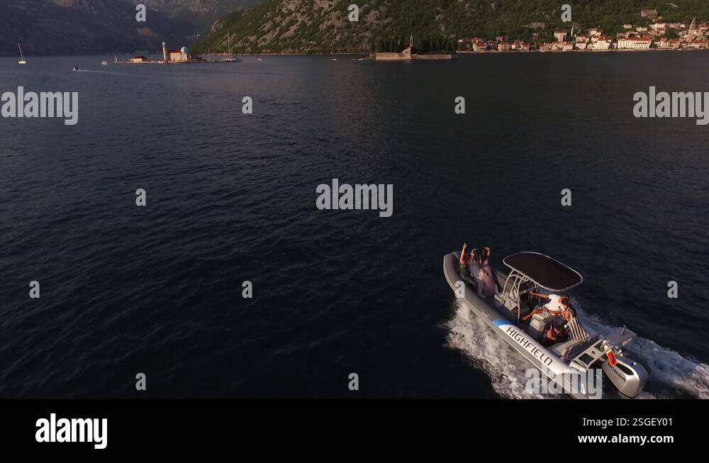 Inflatable boat floats to the island of St. George. Montenegro Stock ...