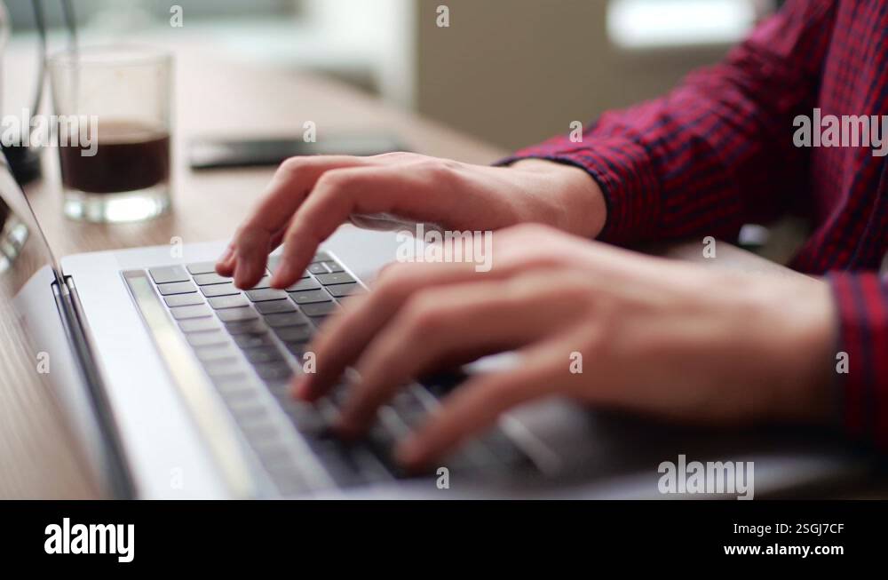Close up of freelancer's developer hands typing program code on laptop ...