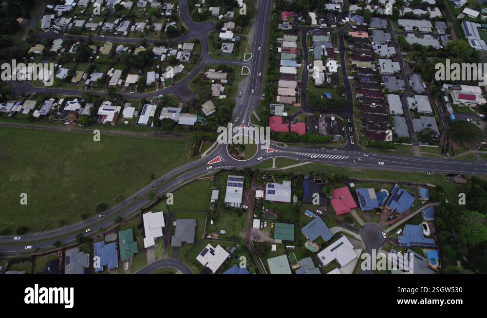 Cars Driving On The Street To The Roundabout In The Suburb In Cairns ...