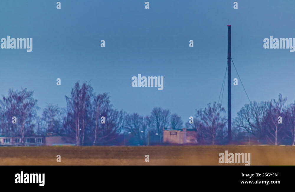 Heat distortion process above agriculture fields, telephoto zoom lens ...