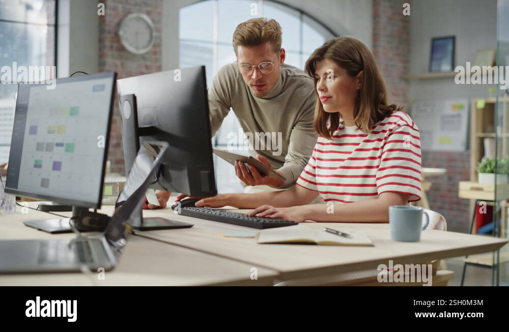 People Discussing Work Using Computer in Office Stock Video Footage - Alamy