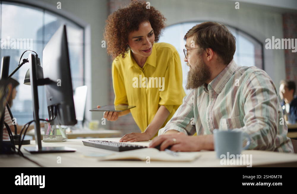 People Discussing Work Using Computer in Office Stock Video Footage - Alamy