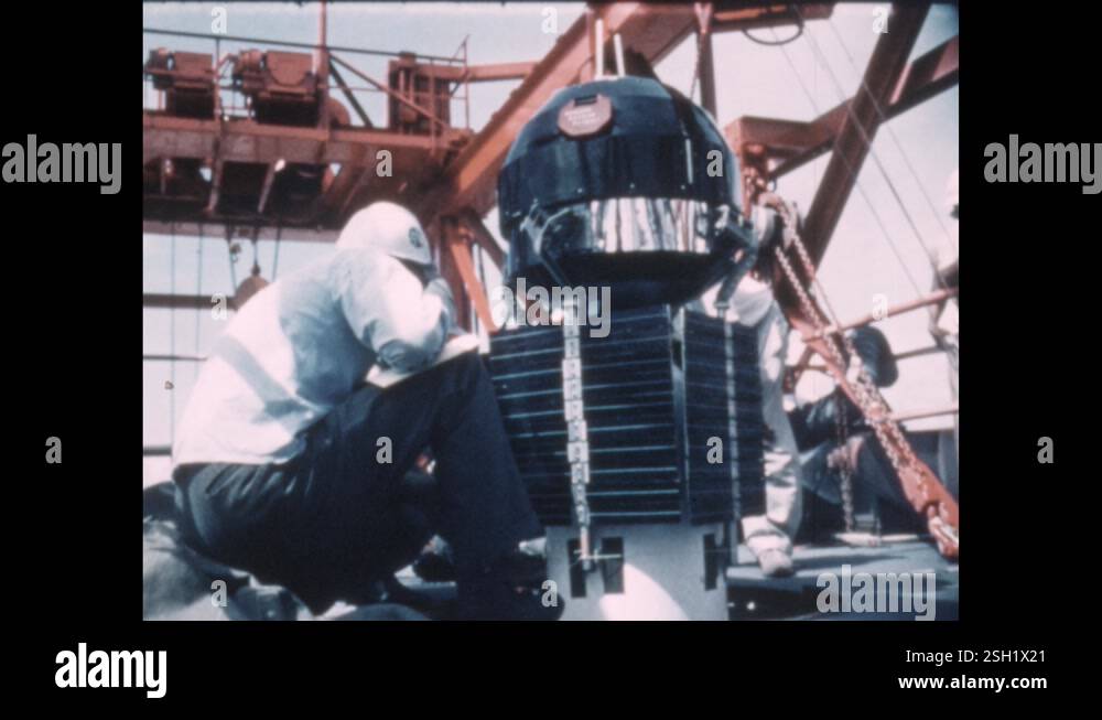 1960s: Engineers adjust panels and rods on satellite Stock Video ...