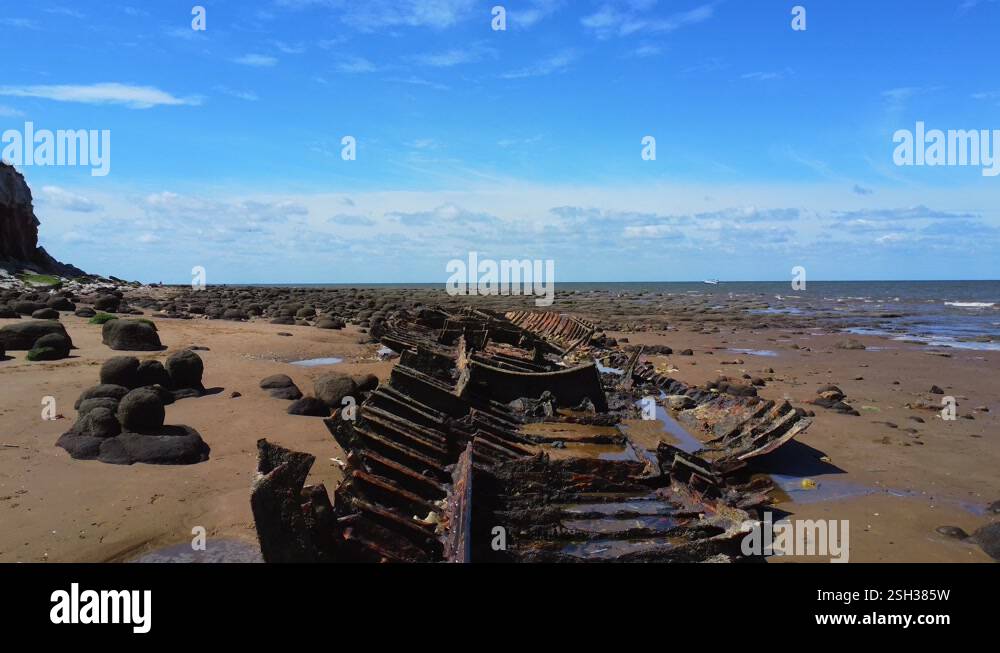 Prawl Point Wreck Rusting Close aerial view of an old ship wreck rusting away on the beach at ...