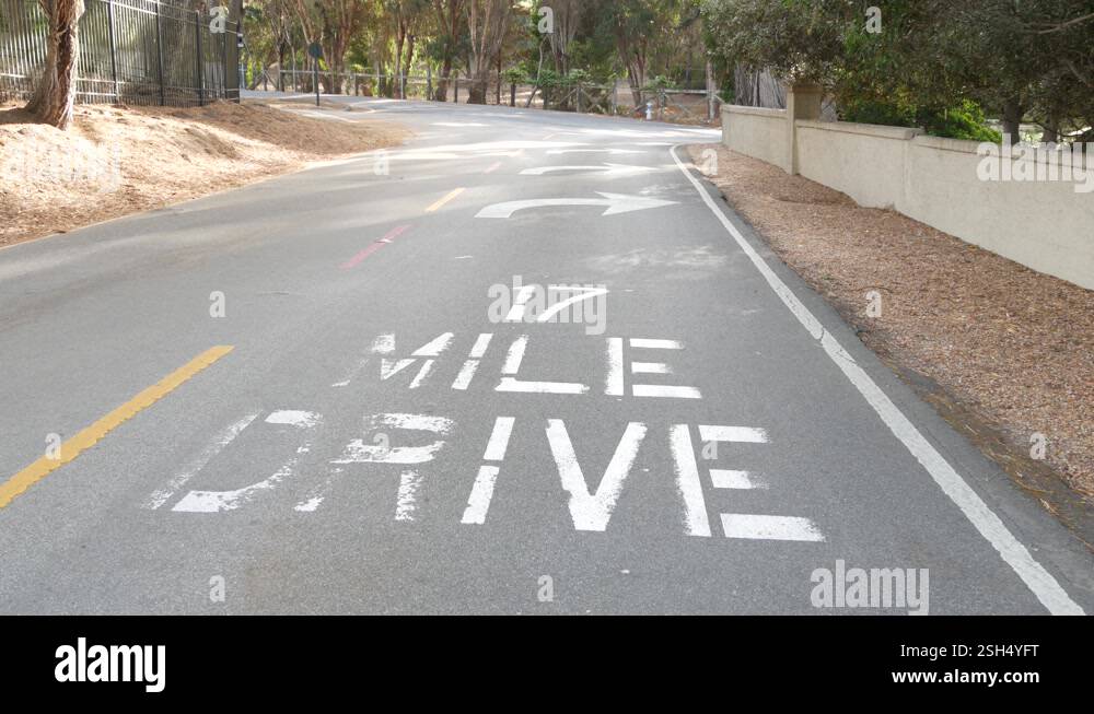 Scenic 17-mile drive, Monterey, California coast. Sign on asphalt, road ...