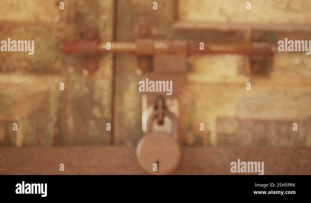 Zoom out into a blur. Big pad lock on the gate. Rusty Lock Stock Video ...