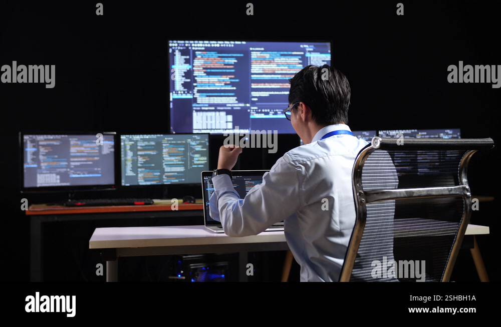 Back View Of Asian Male Programmer Celebrating Succeed Writing Code By ...