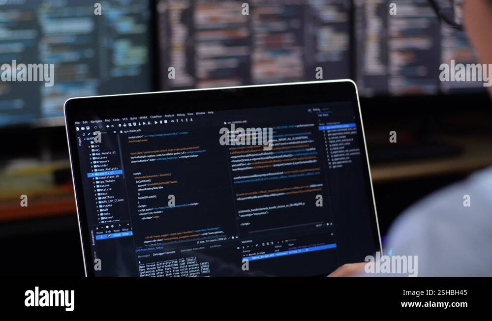 Close Up Of A Laptop'S Monitor Showing Database Being Written By A Male ...