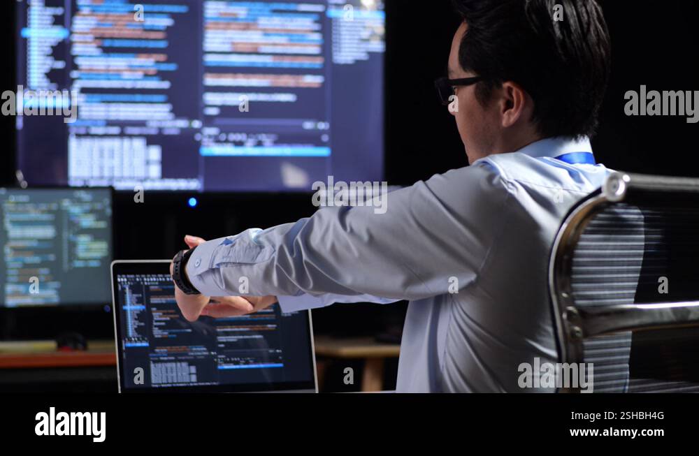 Close Up Back View Of Asian Male Programmer Stretching While Writing ...