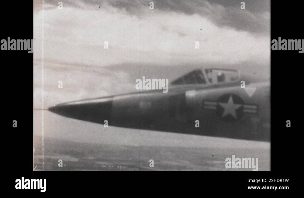 1950s: F-102 American Airforce fighter jets in sky. Pilot in oxygen ...