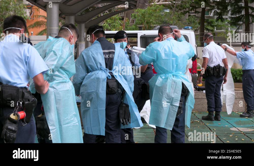 Ppe In Police Police officers wearing personal protective equipment (PPE) outside a ...