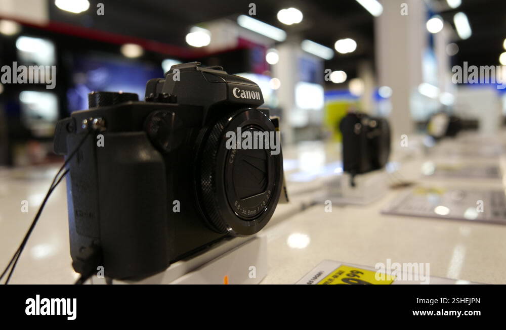 The motion of the display Canon camera inside an electrical store with ...