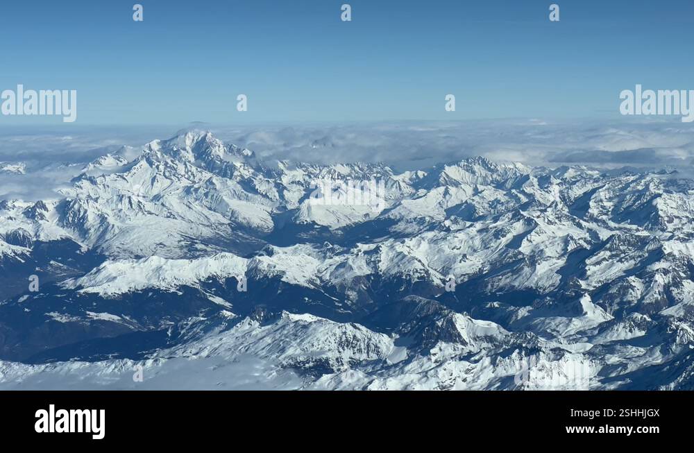 Aerial side view of the Alps mountains and the Mont Blanc peak shot ...