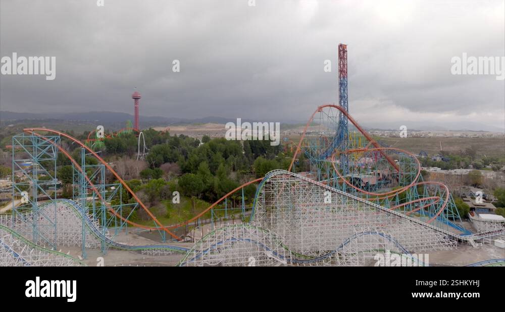 Rising aerial view Six flags Magic mountain theme park rollercoaster ...