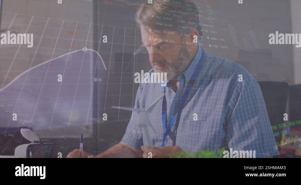 Animation of financial data processing over caucasian male engineer ...
