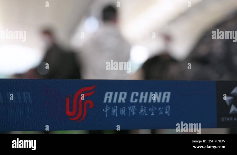 Queue Flag Chinese flag carrier Air China airline logo is seen on a queue belt in ...