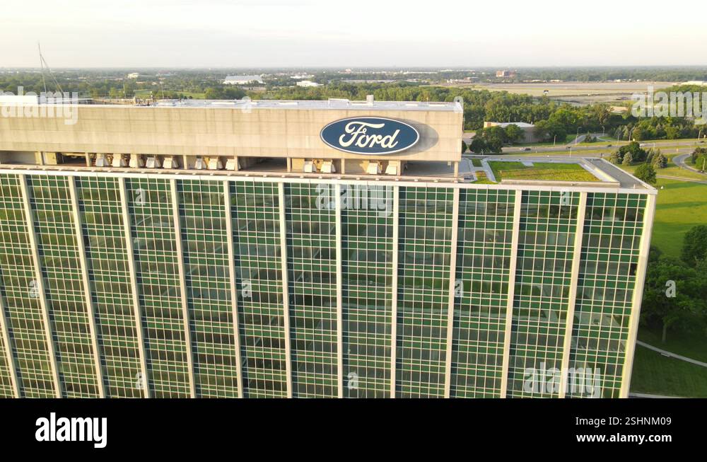 Ford logo on office building top, aerial fly backward view Stock Video ...