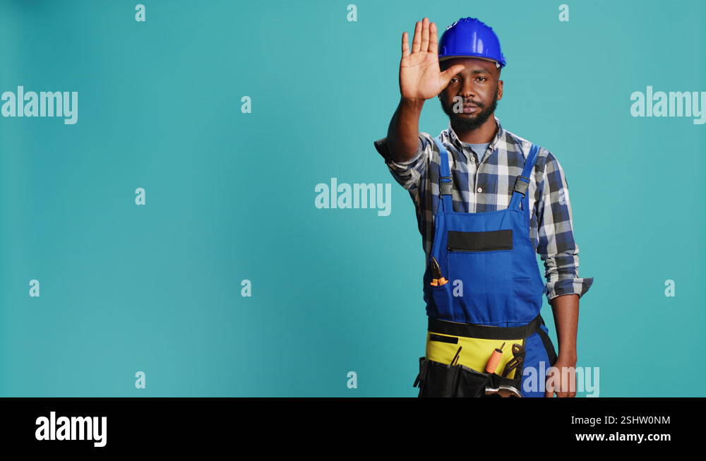 Construction worker raising hand doing stop sign Stock Video Footage ...