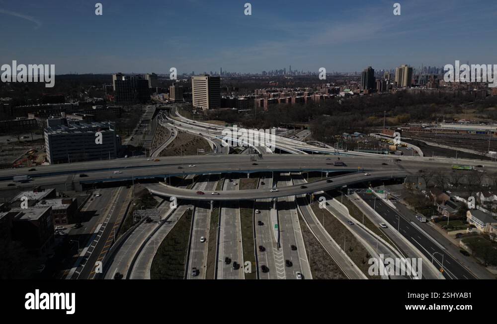 An aerial view high over a highway intersection in Queens, New York on ...
