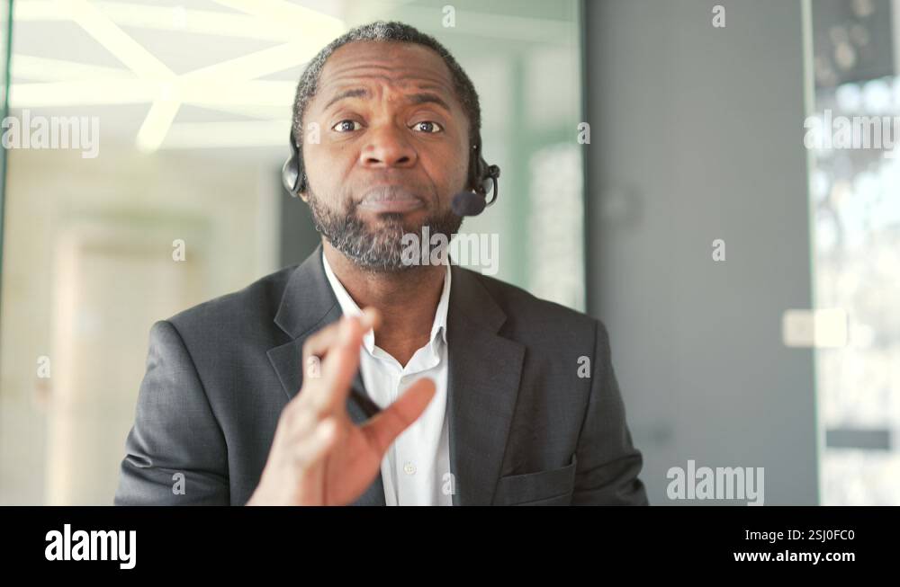 Close up. Webcam view. A corporate operator who works in customer ...