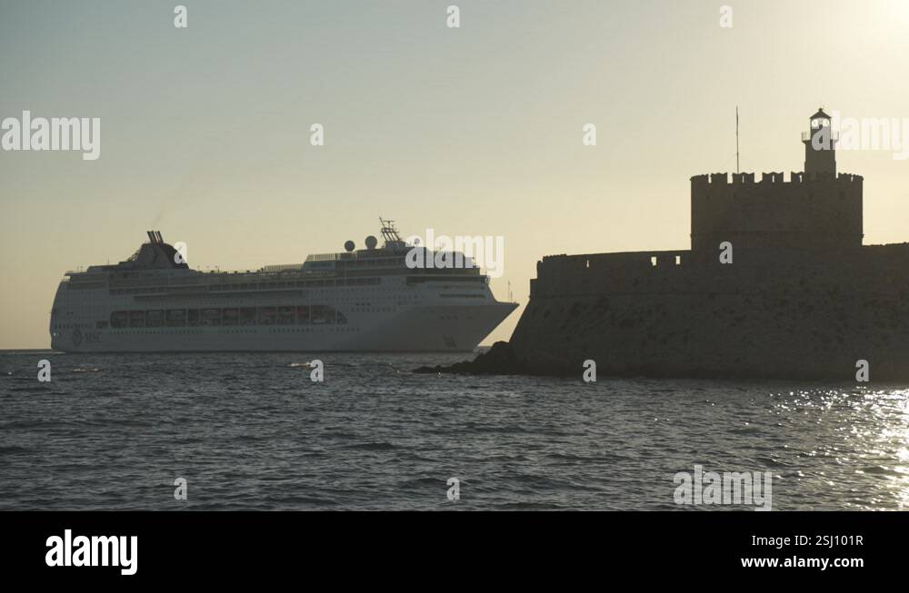 Cruise ship passes Saint Nicholas Fortress at sunrise, City of Rhodes ...