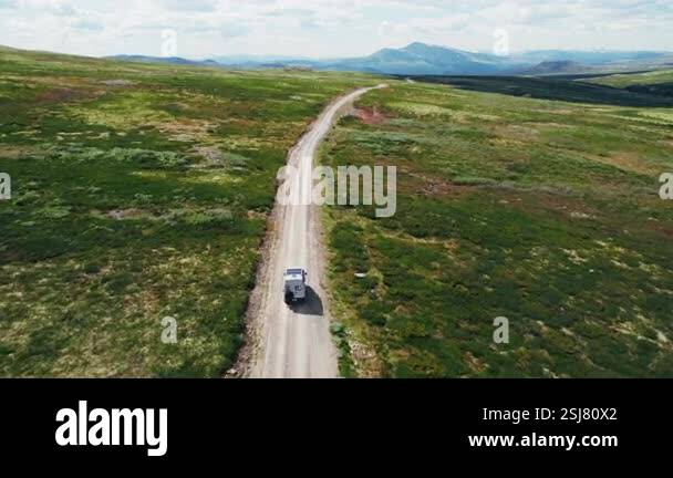 Drone follows offroad and off grid self built van with solar panels on ...