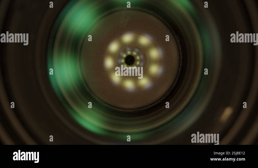 Lens and aperture inside the lens, camera inside, light reflection ...