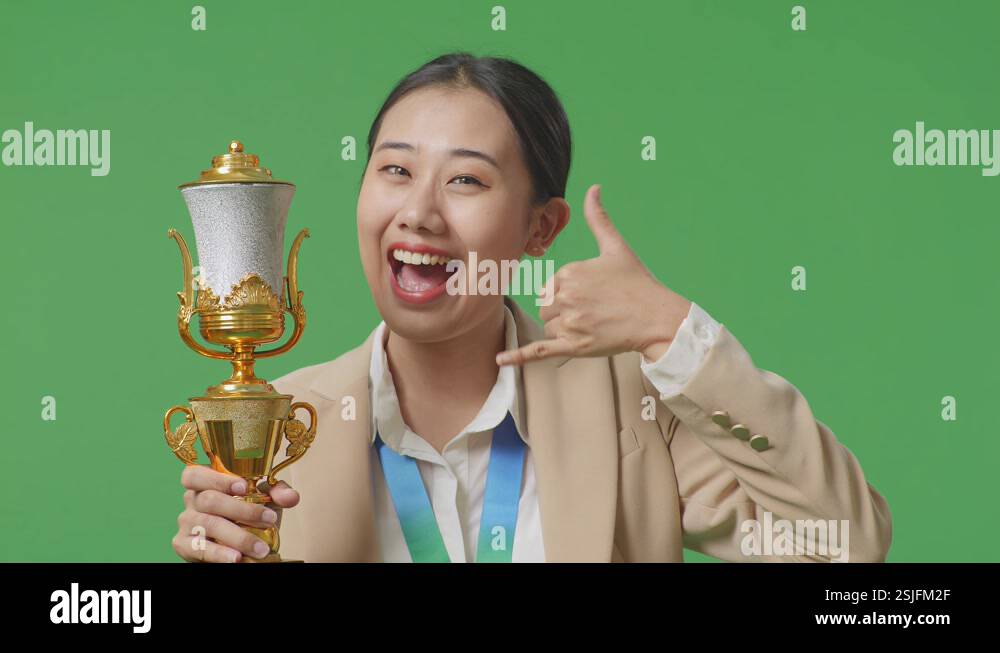 Close Up Of Asian Business Woman In A Suit With A Gold Medal And Trophy ...