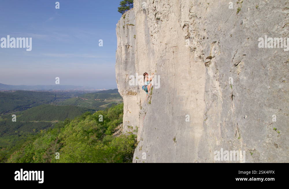 AERIAL: Adrenaline climbing on a sharp end of the rope at picturesque ...