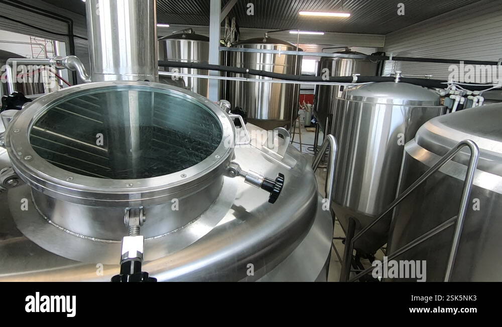 Beer production. Stainless steel containers for brewing beer. automated ...