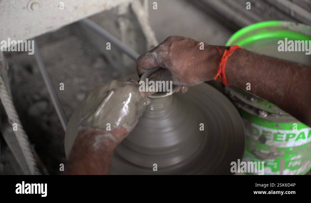 A potter is making clay objects with a pot Stock Video Footage - Alamy