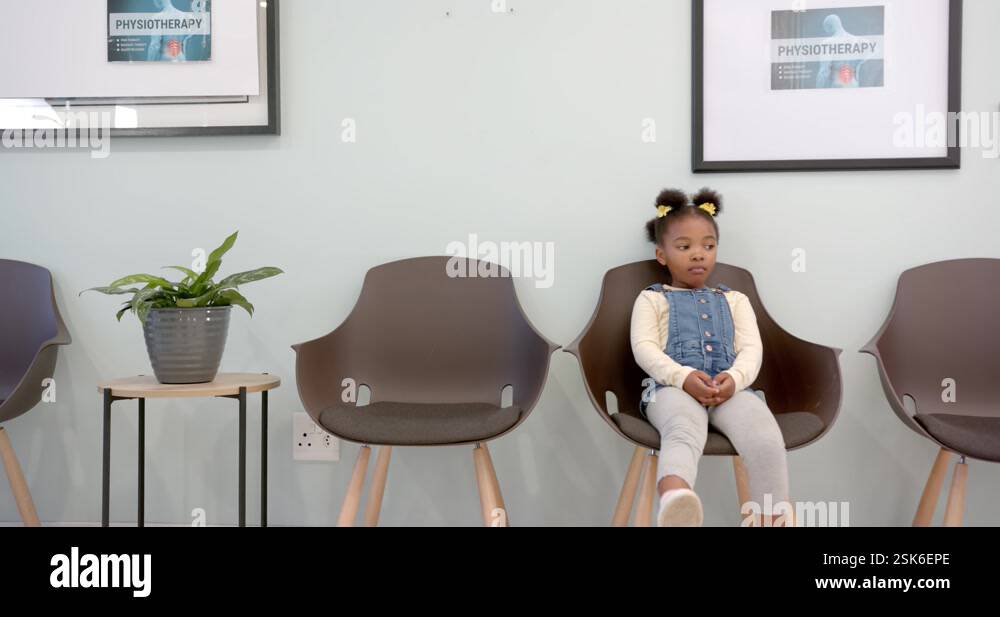 african-american-girl-sitting-in-hospital-waiting-room-with-copy-space