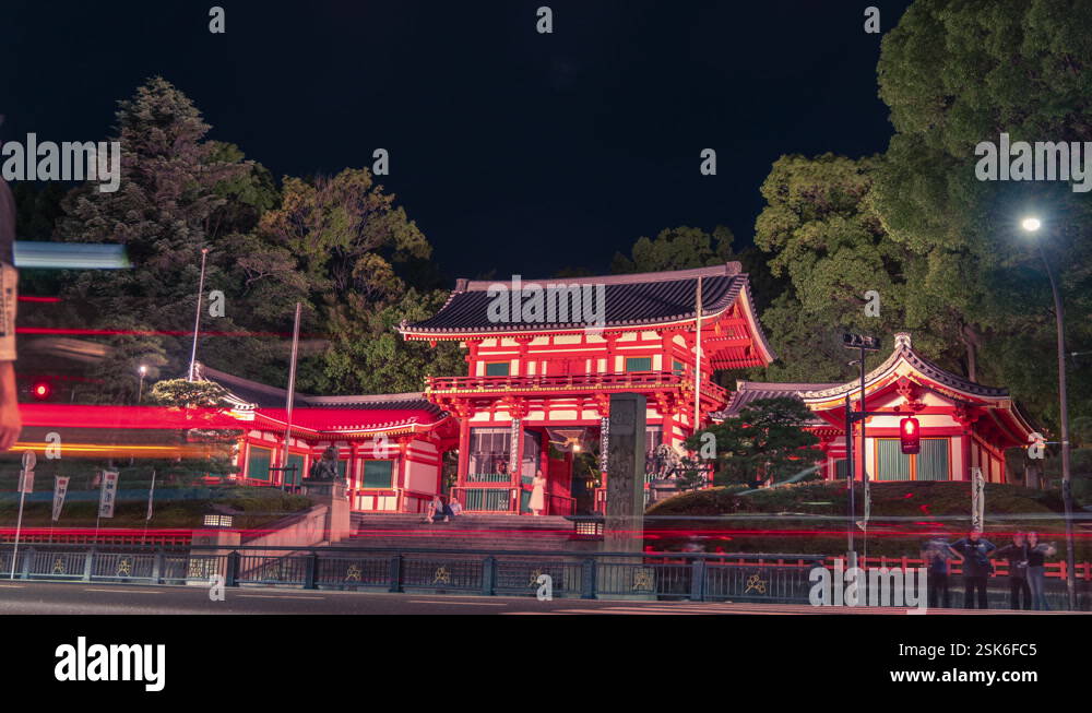 Yasaka jinja temple shrine at Kyoto Japan night time lapse city traffic ...