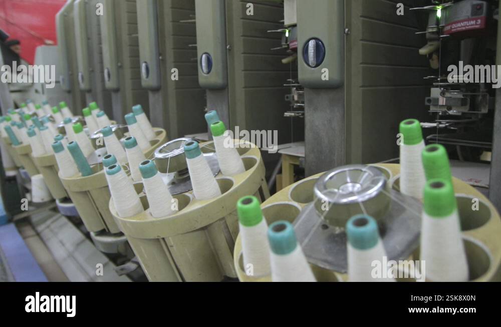 Spools Of Cotton Thread Processed By A Automated Spinning Machine Stock ...