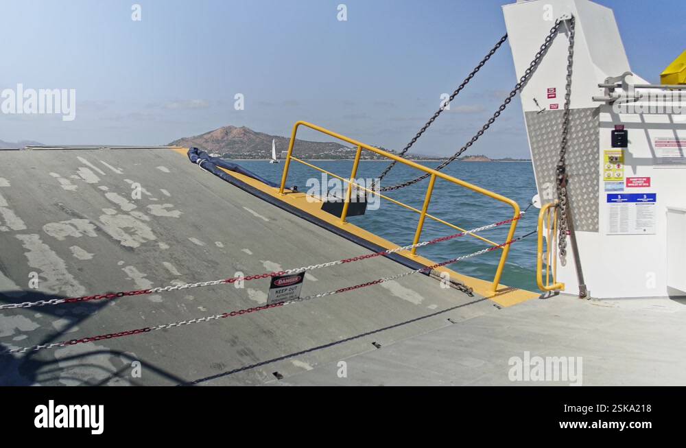 Chained Ramp A barge moving on the open water with the ramp lifted and chained off ...
