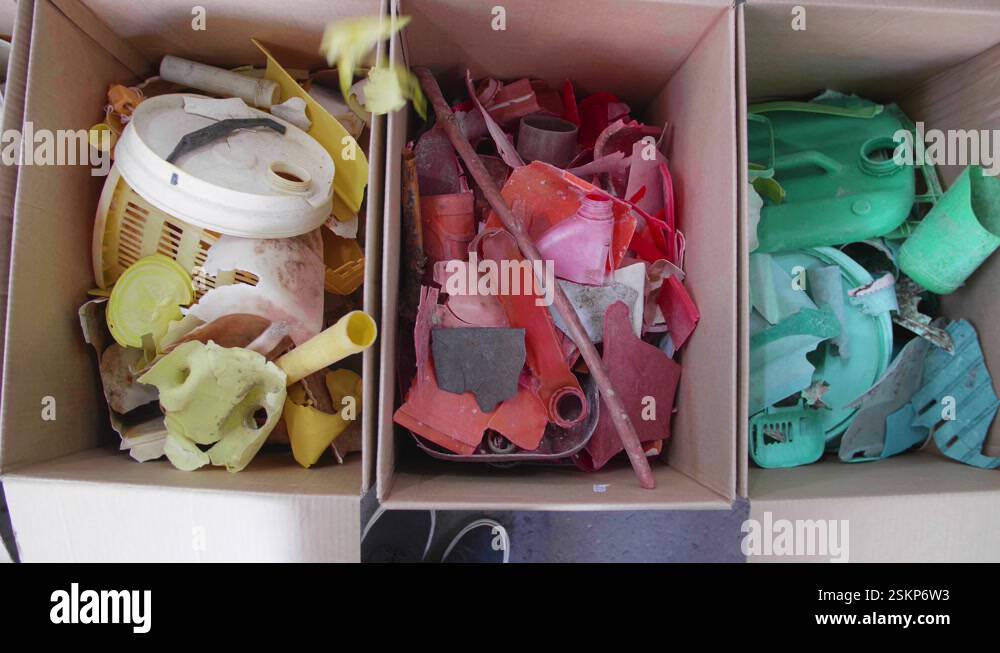 Recycle, Reduce, Reuse. Asian Woman Color Sorting Scraps Of Plastic ...