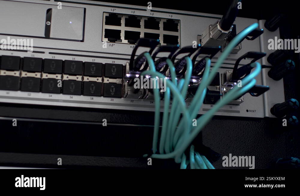 LAN Cables Plugged In Network Server Rack With White Blinking Lights ...